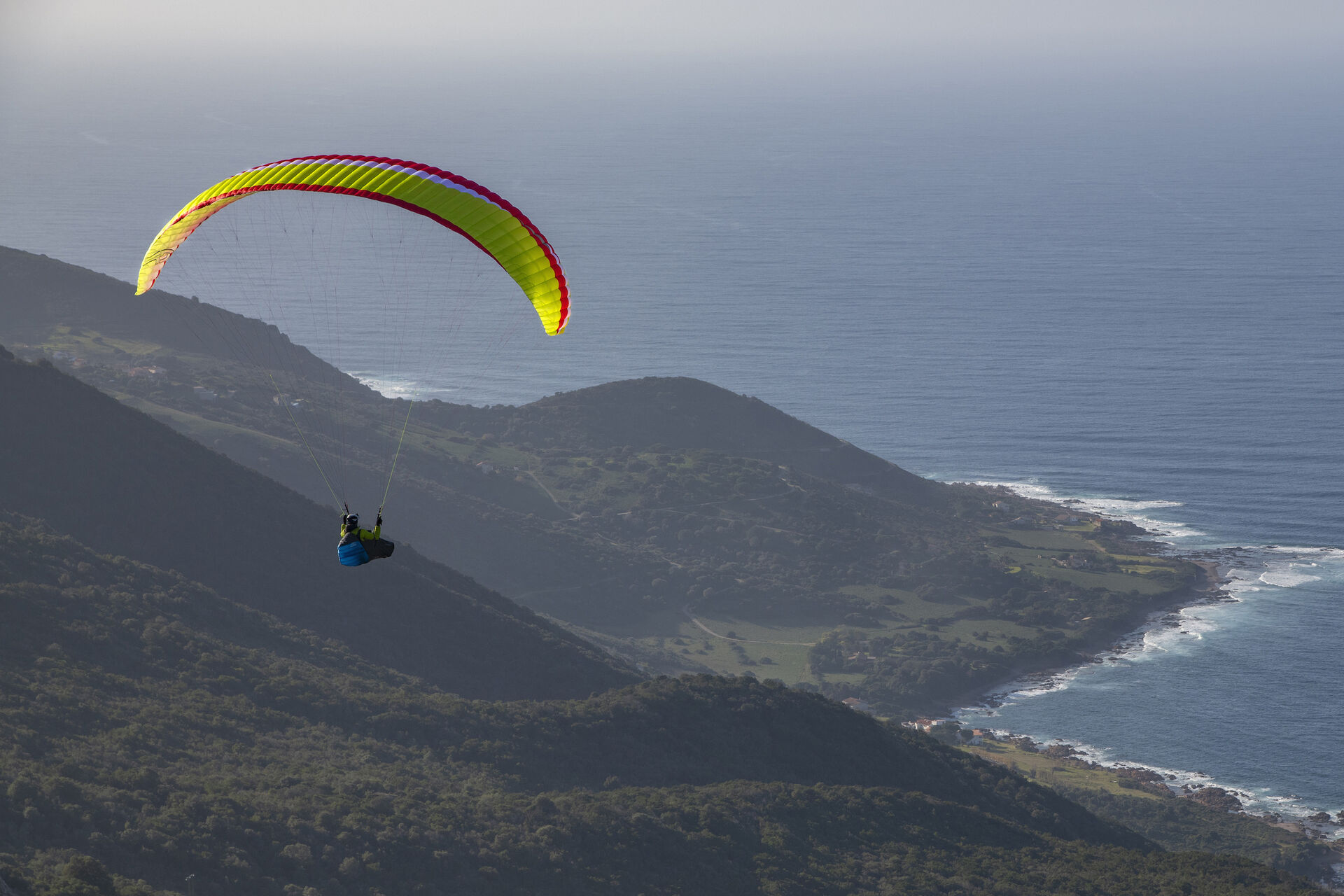 Air Design Vivo 2 paraglider soaring above coastline